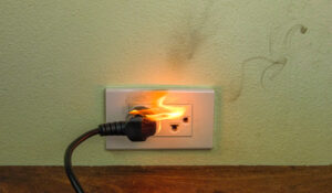 Licensed electrician repairing common electrical problems in a residential home