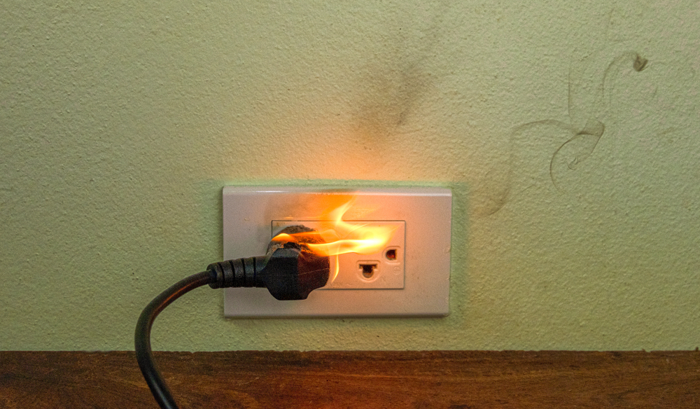 Licensed electrician repairing common electrical problems in a residential home