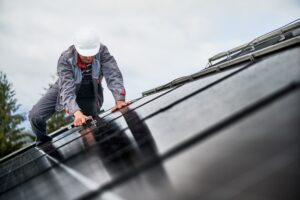 Electrician explaining home generator installation cost and setup requirements to homeowners
