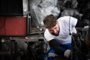 Technician inspecting a generator not starting during a power outage troubleshooting process