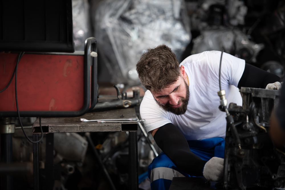 Technician inspecting a generator not starting during a power outage troubleshooting process