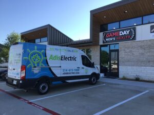 Licensed electrician completing electrical upgrades for luxury outdoor kitchen and pool areas, including outdoor lighting, power outlets, and equipment connections for a high-end backyard.